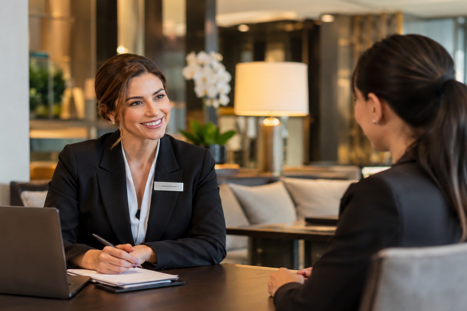 Recruitment consultant meeting an employer to discuss staffing requirements